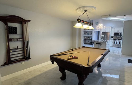 Golf and Sea Village of Apollo Beach House | Inviting Retreat with Heated Pool, Games & Ocean Views
