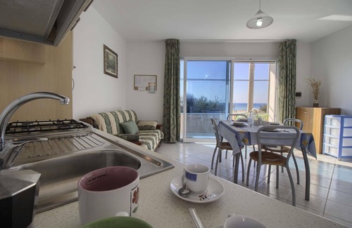Posto Vecchio Apartment | Cozy Front Beach Posto Vecchio 1: Spa & Child-Friendly Stays