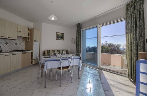 Posto Vecchio Apartment | Cozy Front Beach Posto Vecchio 1: Spa & Child-Friendly Stays
