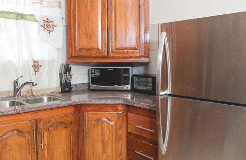 Graeme Hall Terrace Apartment | Top-Rated Frontline Apartment No. 2 with Family Amenities