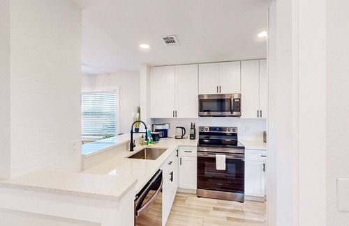 Bay Acres House | ```html
Beautiful Beach Duplex with Renovated Interior & Pet Welcome
```