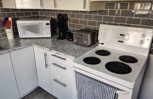 Regina Apartment | Modern 1 Bedroom Retreat with Dedicated Parking & Breakfast