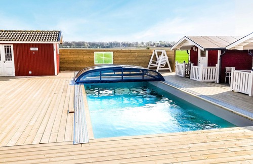 Morup Apartment | Enjoy a Relaxing Stay with Pool and Lake Views