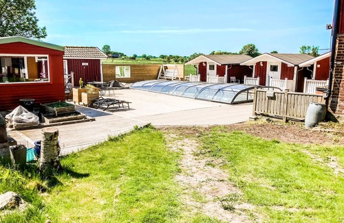 Morup Apartment | Enjoy a Relaxing Stay with Pool and Lake Views