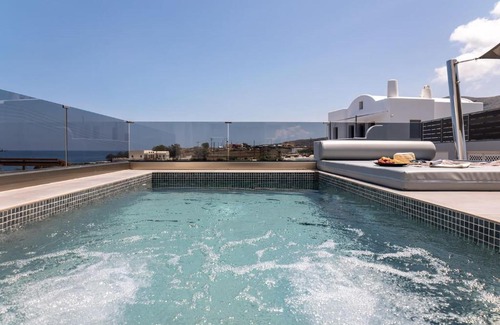 Kamari Apartment | G & W Suites: 4-Star Oceanfront Retreat with Hot Tub