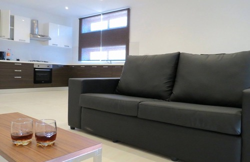 Marsaskala Apartment | Seaview Apartment: Beachside Oasis with Oceanfront Pool