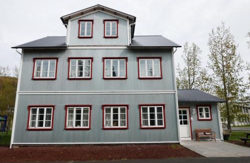 Husavik Apartment | Discover Gamli Skólinn Húsavík: 4-Star Family Retreat