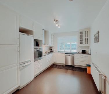 Husavik Apartment | Discover Gamli Skólinn Húsavík: 4-Star Family Retreat