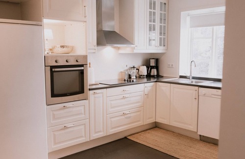 Husavik Apartment | Discover Gamli Skolinn Husavik: Family-Friendly Retreat