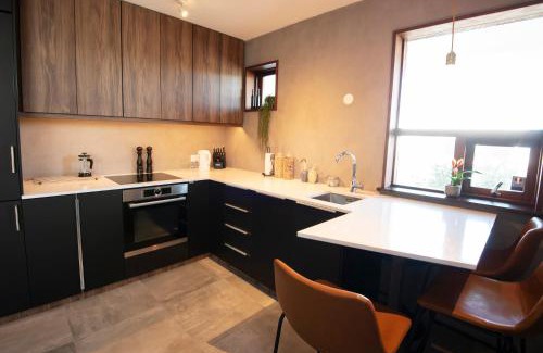 Hafnarfjordur Apartment | Elegant Gardabær Sea View Apartment with Hot Tub Amenities