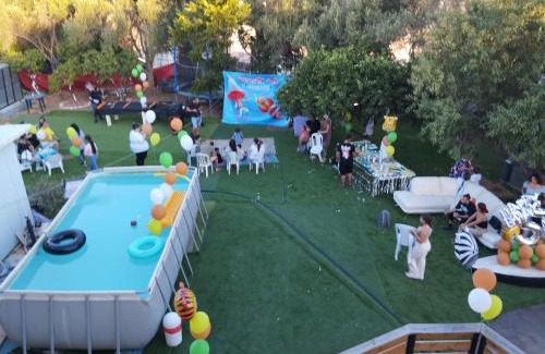 Shlomi Ski Chalet | Experience Garden on TOP of the WORLD: 4-Star Ocean View Retreat