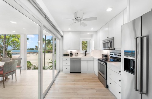 Rum Point House | Beachfront Villa with Communal Pool and Free Kayak Access