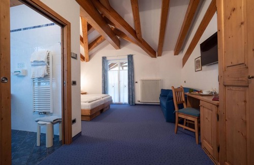 Dimaro Hotel | Discover Garni Sottobosco: Cozy Stay with Family-Friendly Perks