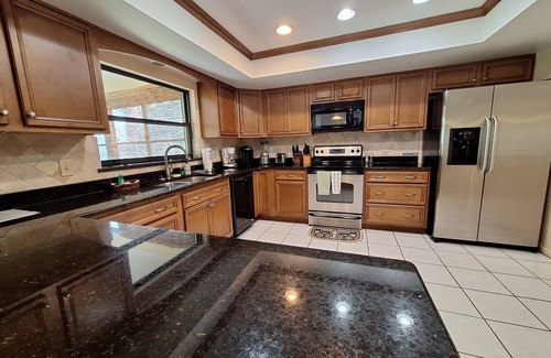 Oviedo House | Lakefront 3-Bed Ranch with Hot Tub & Exceptional Reviews