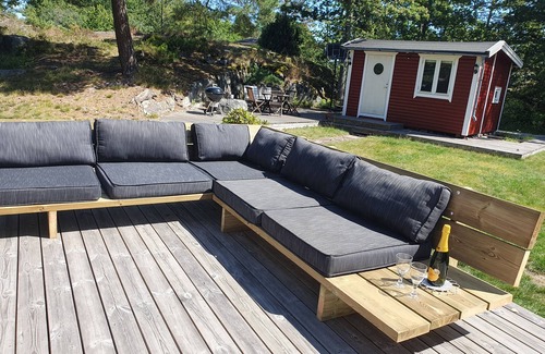 Djurhamn Cabin | Cozy Vacation Home with Boat, Steps from the Beach