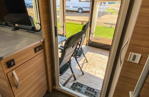 Belau House | Experience George Glamper Moin at Lake Belau's Beachfront Oasis