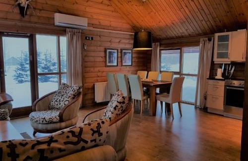 Haukadalur House | Geysir - Modern Log Cabin with Ocean View & Hot Tub