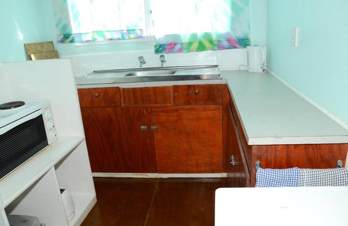 Aitutaki Hotel | Cozy Gina's Garden Lodges with Kitchen & Family-Friendly Amenities