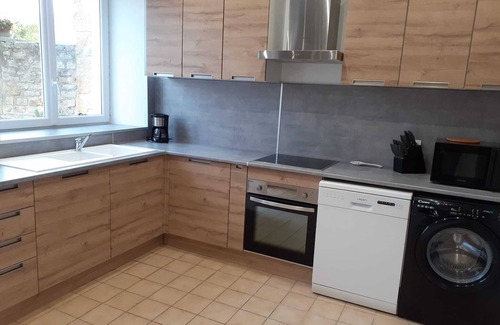 Le Planet House | Oceanfront Gite des Falaises de Longues with Family Amenities