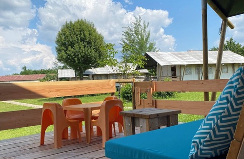 Jayac RV Rental | Glamping 'Safarilodge Prestige Tent 10 5pers' with Shared Pool, Wi-Fi and Air Conditioning
