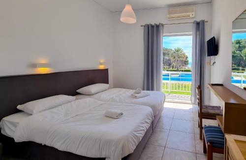 Pineios Hotel | Experience Glyfa Beach Hotel with Oceanfront Views