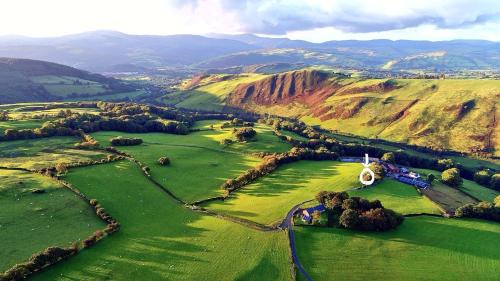 Machynlleth House | Kid-Friendly Glyndwr Way Cabin with Great Guest Reviews