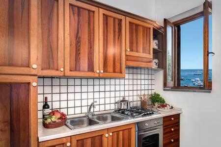 Marina del Cantone Apartment | Ginestra Beach Suite: Family-Friendly & Pet Welcome Retreat
