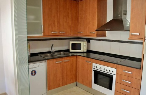 Sant Carles de la Rapita Apartment | Relax at Golden Beach: Oceanfront with Pool & Spa