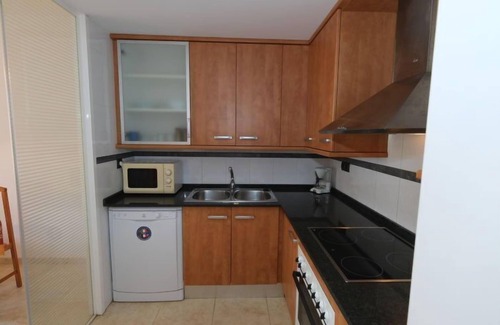 Sant Carles de la Rapita Apartment | Relax at Golden Beach: Oceanfront with Pool & Spa