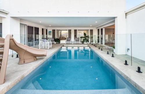 Golden Beach House | Golden Beach Family Getaway with Pool & Spa Amenities