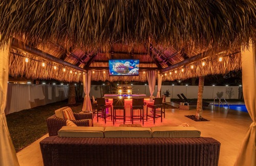 Boynton Beach House | Golfers Green Retreat with 35' Heated Saltwater Pool & Tiki. Pet Friendly!