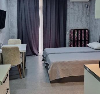 T'ba Apartment | Cozy Gonio: Family-Friendly Stay with Pool Access
