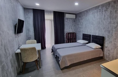 T'ba Apartment | Cozy Gonio: Family-Friendly Stay with Pool Access