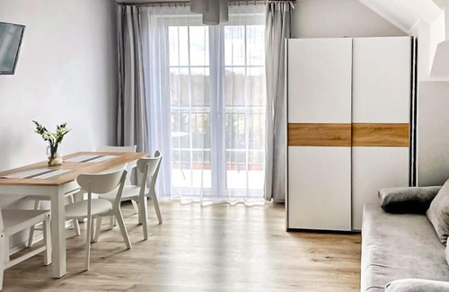 Karwia Apartment | Modern Vacation Apartment with Family-Friendly Garden