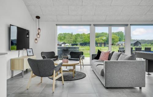 Fjellerup Strand House | Inviting Home in Glesborg with Pool and Kitchen Access