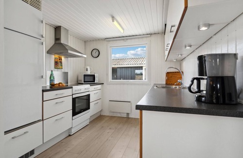 Haurvig House | Experience a Cozy Oceanfront Retreat with Scenic Views