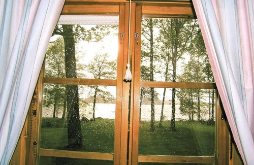 Ljungby House | Experience a Unique Wooden House on Lake Flären