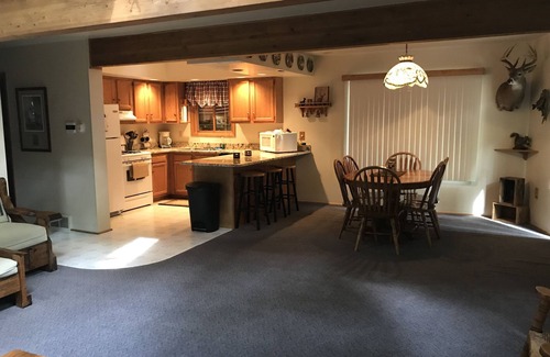 Kalkaska House | Inviting Waterfront Retreat with Pool and Lake Views
