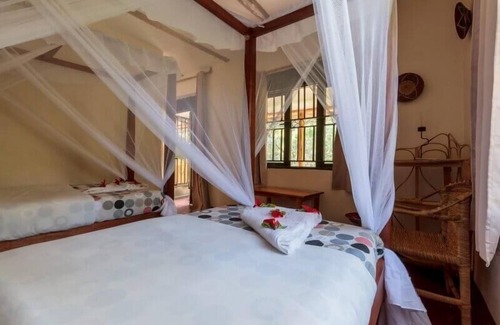 Bwindi Cabin | Gorilla Valley Lodge: Family-Friendly Retreat with Dining Options