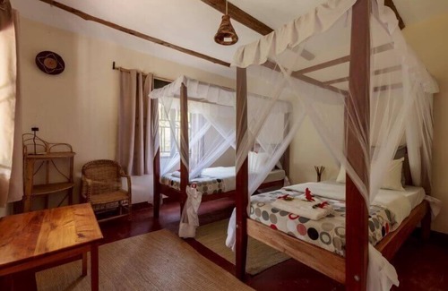 Bwindi Cabin | Gorilla Valley Lodge: Family-Friendly Retreat with Dining Options