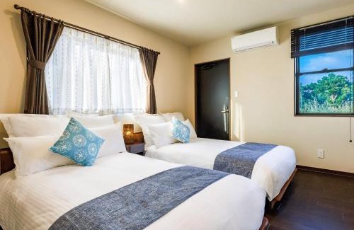 Ueno Villa | Grace Villa Miyakojima: Oceanfront Escape with Hot Tub