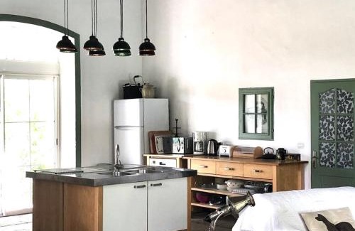 Pomas House | Elegant Loft with Private Pool at Historic Train Station