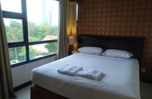 Tanjung Duren Utara Hotel | Discover Grand Tropic Suites Hotel with Pool & Family Fun