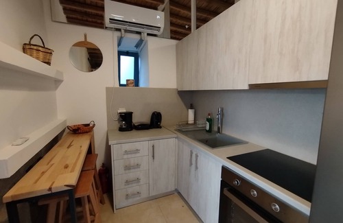 Lagoudi Zia Apartment | Experience Grandpa's Place: Historic Home by Zia's Balcony
