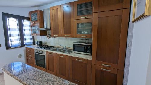 Gonnesa Apartment | Cozy Attic Retreat with Kitchen, Child-Friendly Amenities
