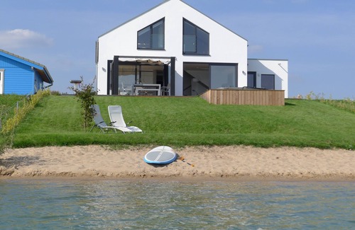 Lobnitz House | Inviting Getaway with Fireplace and Sauna by the Lake