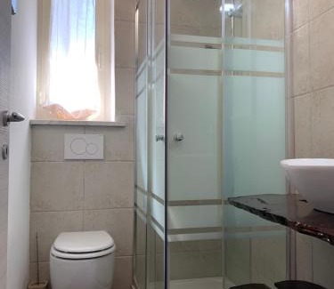 Castelforte Apartment | Exquisite Green Oasis Gabella Monolocale with Oceanfront Views