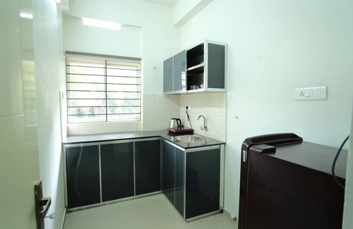 Kozhikode Apartment | Greens Apartments: Your Ideal Family Retreat with Kitchen