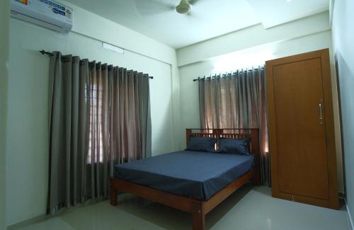 Kozhikode Apartment | Family-Friendly Greens: Highly Rated with Great Amenities