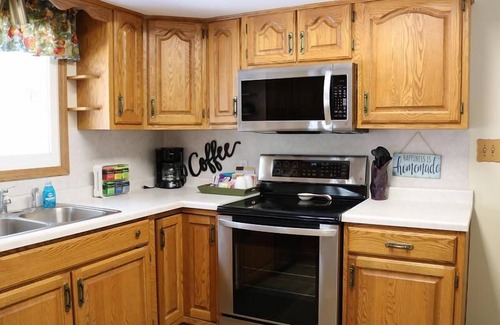 Escanaba House | Greenwood Getaway: Fun Game Room & Pet-Friendly Retreat